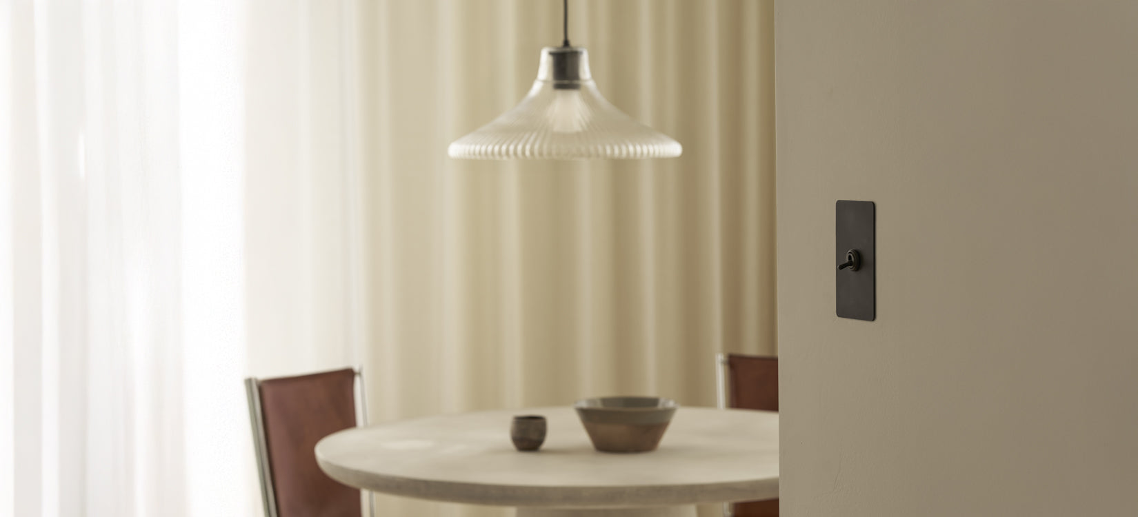 Corston pendant light and toggle switch in a styled dining nook