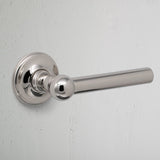 polished nickel harper mortice door handle on white background